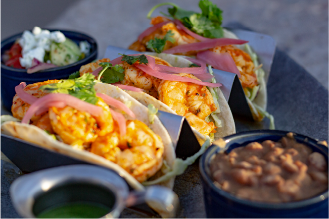 Glossy Heifer Grill shrimp tacos with vibrant toppings, American cuisine photography by Matthew Spaulding on matthewspaulding.co